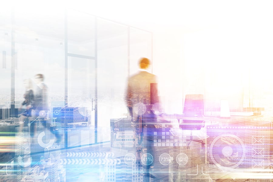 Businessman walking through a bright office with data overlays