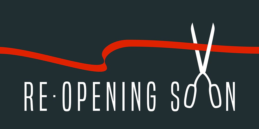 Re-opening soon banner with a scissors and ribbon graphic