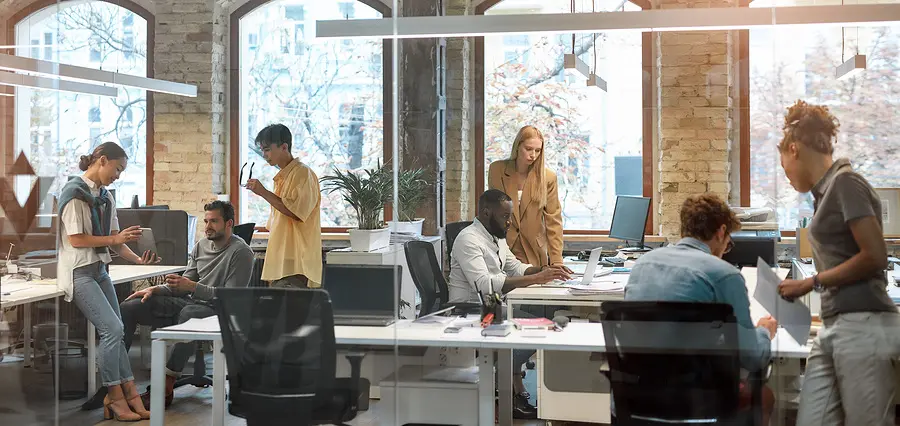 Team of colleagues working together in an open office