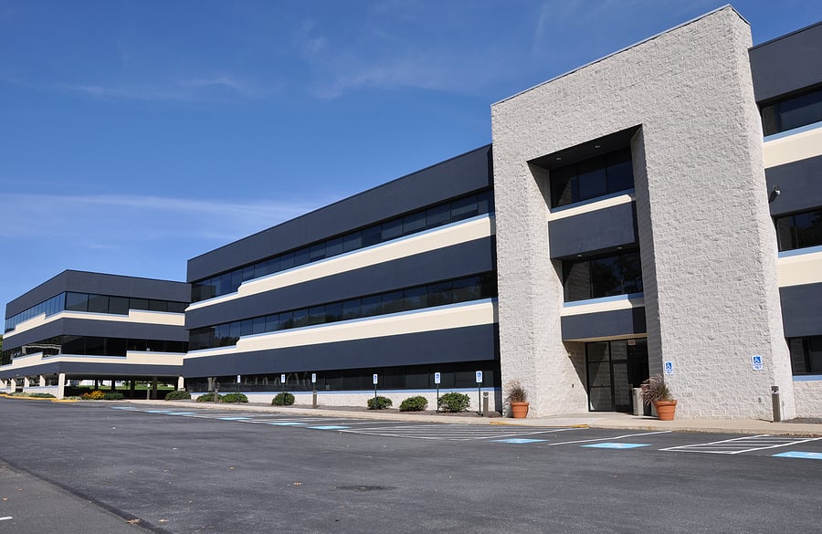 Exterior of a modern three-story commercial office building