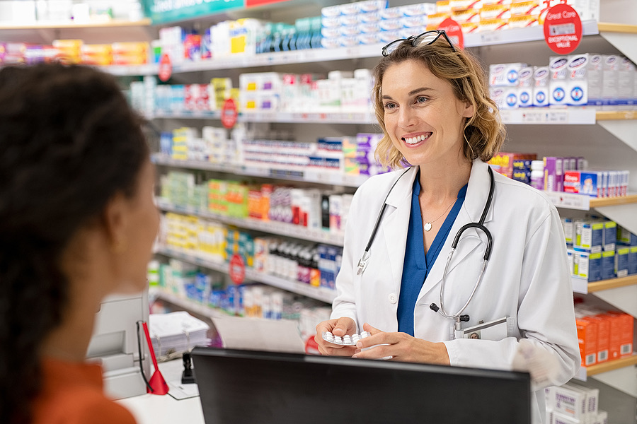 Pharmacist helping a customer at the pharmacy counter